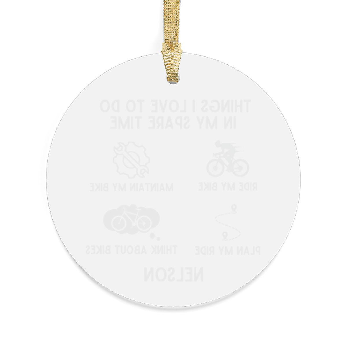 Transparent acrylic ornament adorned with a golden ribbon, showcasing subtle illustrations and text related to biking activities. The Personalized Cyclist Ornament, ideal for cycling enthusiasts, celebrates the spirit of biking in a festive manner.