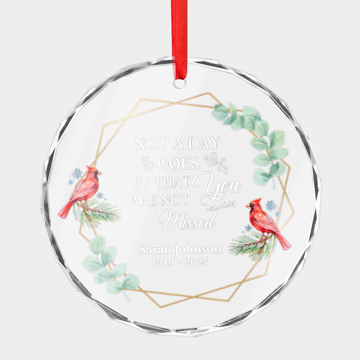 This stunning circular Christmas ornament, crafted from crystal glass, features cardinals and leaves. Personalize it with "Not a day goes by that you are not missed - Sarah Johnson 1940-2024" for a touching bereavement gift. It's the perfect Personalized Cardinal Memorial Christmas Ornament and a heartfelt Crystal Glass Sympathy Gift in remembrance of a loved one.