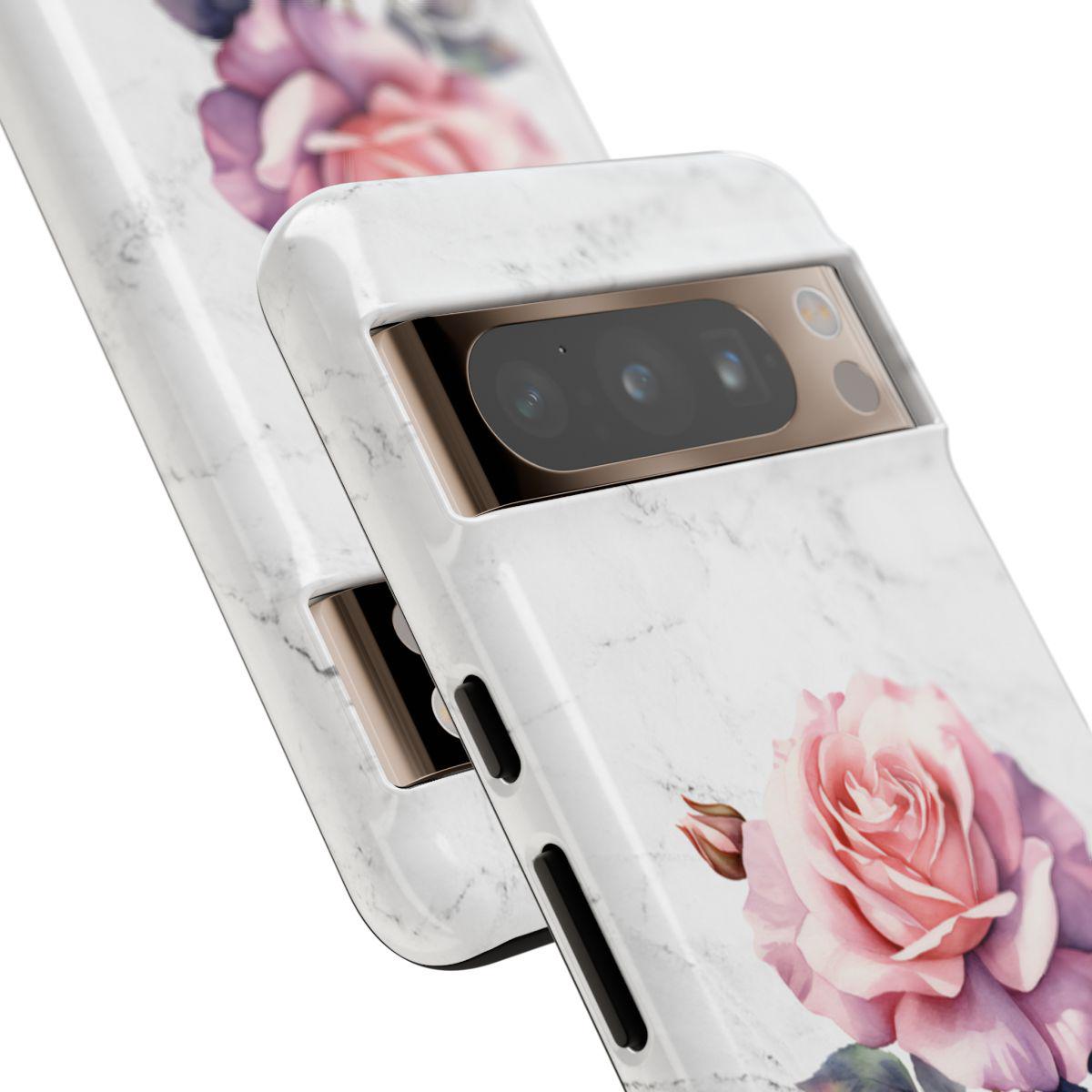Two smartphones with personalized phone cases, featuring birth flower designs with pink roses, beautifully showcase the rear camera modules.