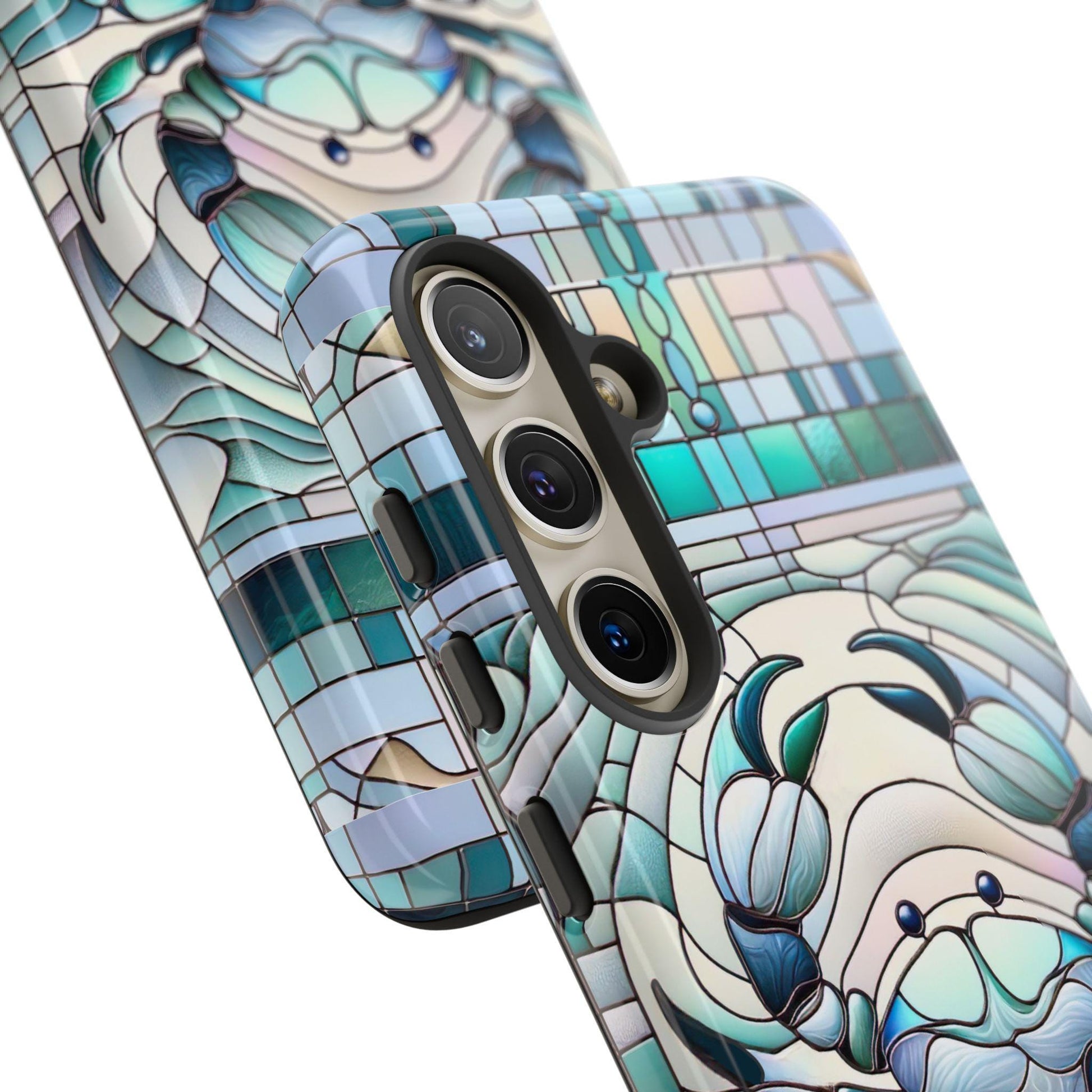 The Zodiac Cancer Faux Stained Glass Mosaic Phone Case, in blue and teal geometric crab design, fits iPhone, Samsung & Pixel models with three camera lenses. This astrology-inspired accessory is an ideal gift for Cancer horoscope enthusiasts who cherish their Zodiac sign.