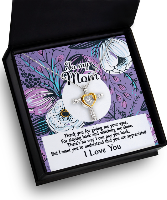 A gift box containing a "To Mom, You Are Appreciated" - Cross Dancing Necklace with a heartfelt message to a mother on a floral background.