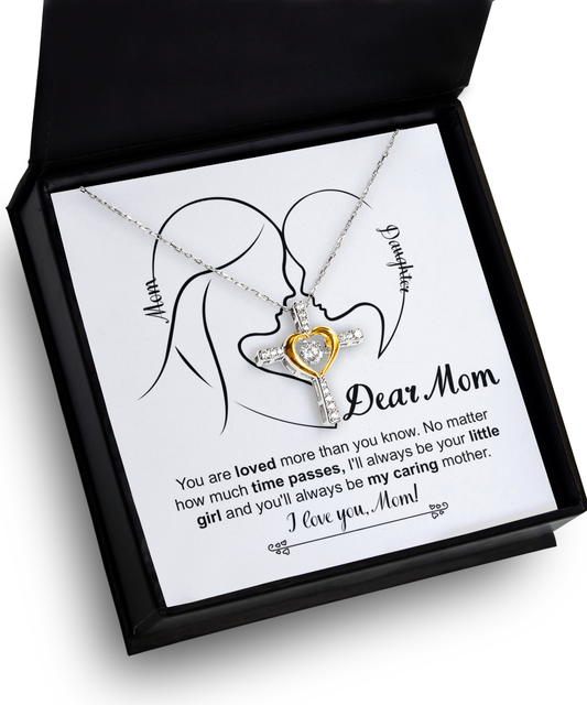 To Mom, Your Little Girl - Cross Dancing Necklace inside a gift box, featuring two angels and a cross, with an inscription to a mother expressing lifelong love and appreciation.