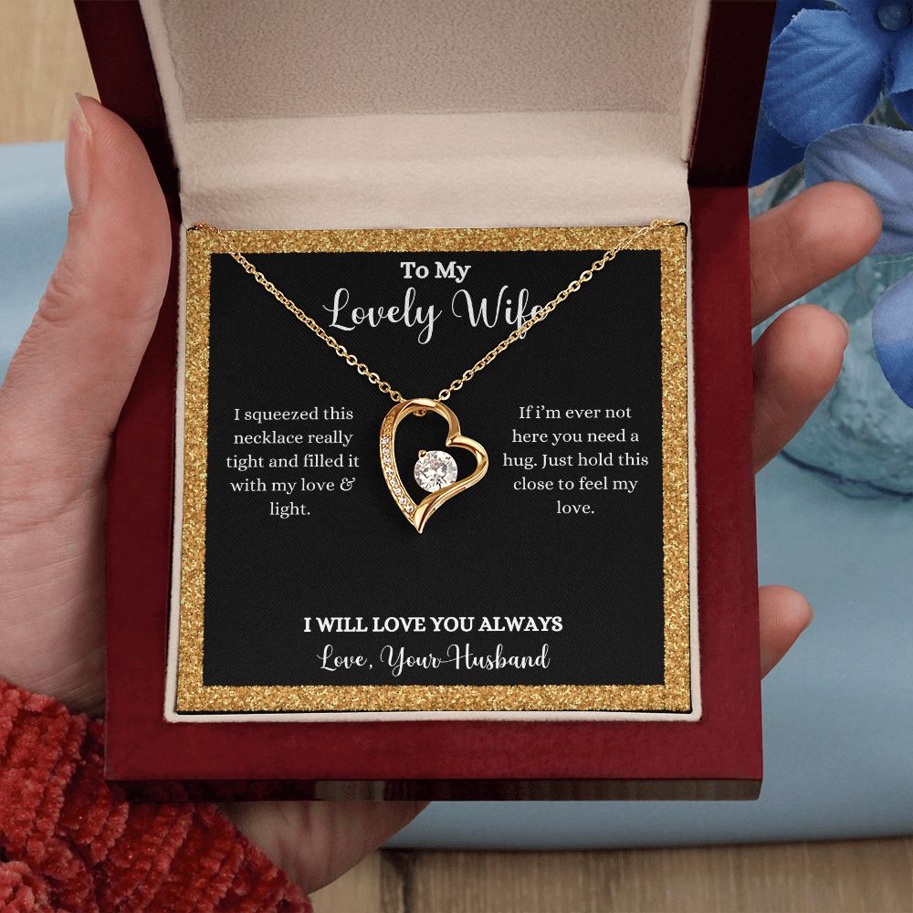 A woman holding an "I Love You Forever Love Necklace - Gift for Wife from Husband" by ShineOn Fulfillment in a box.