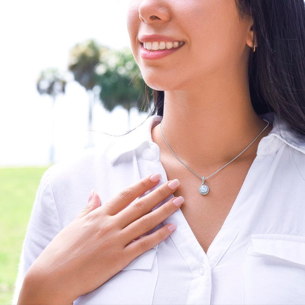 A woman in a white shirt with the I Love You Forever And Always Eternal Hope Necklace - Gift for Daughter from Mom by ShineOn Fulfillment on her chest.