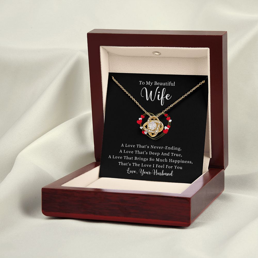 A wooden box with a A Love That's Never-Ending Love Knot Necklace - For Wife by ShineOn Fulfillment in it.