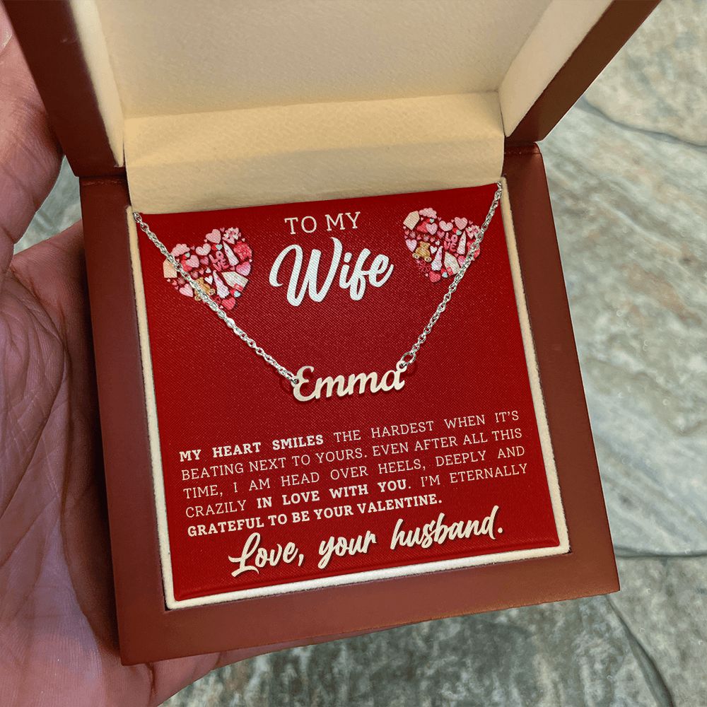 A gift box with a My Heart Smiles Personalized Name Necklace - For Wife from ShineOn Fulfillment that says to my wife ema.