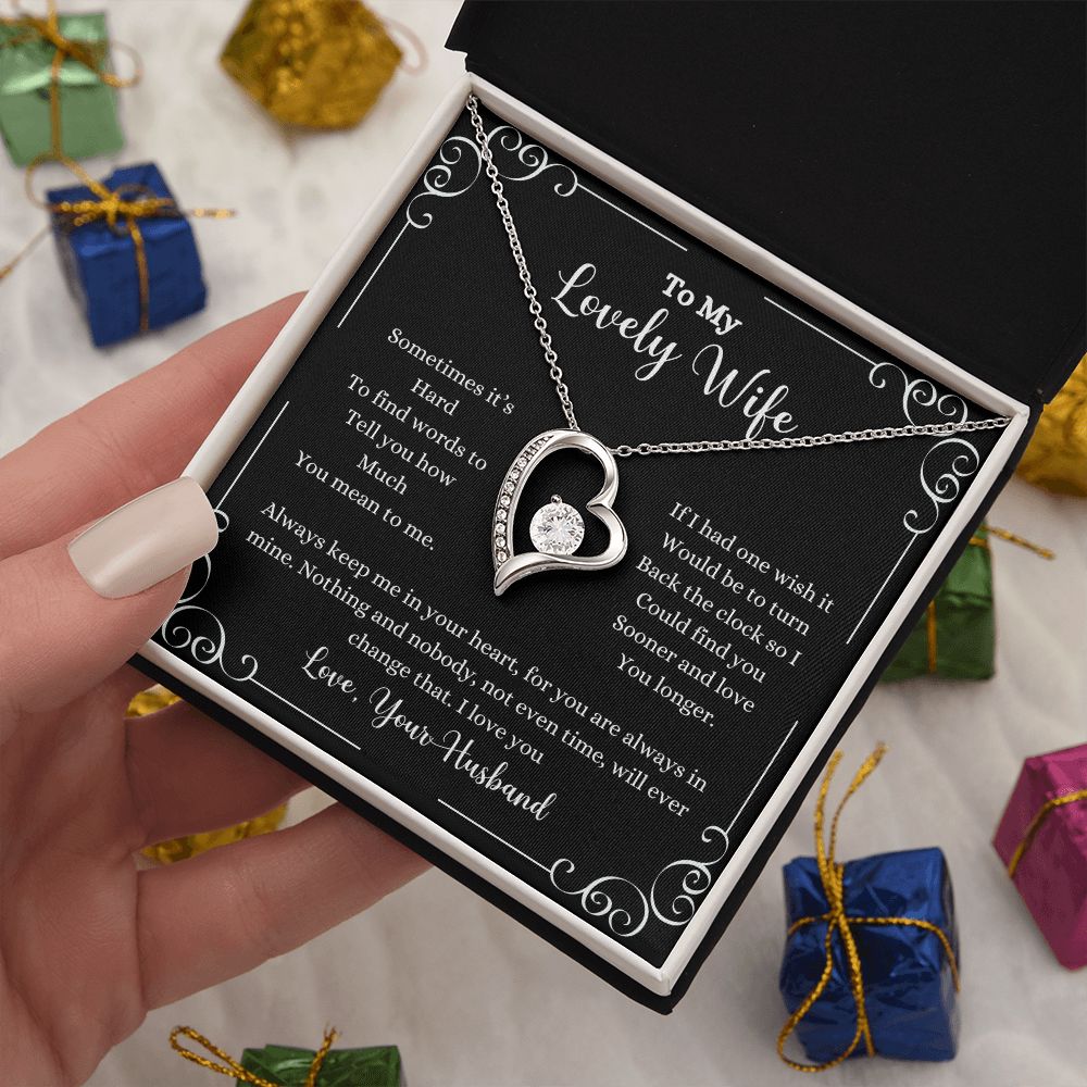 A person holding a gift box with a ShineOn Fulfillment "I Love You Forever Love Necklace - Gift for Wife from Husband".