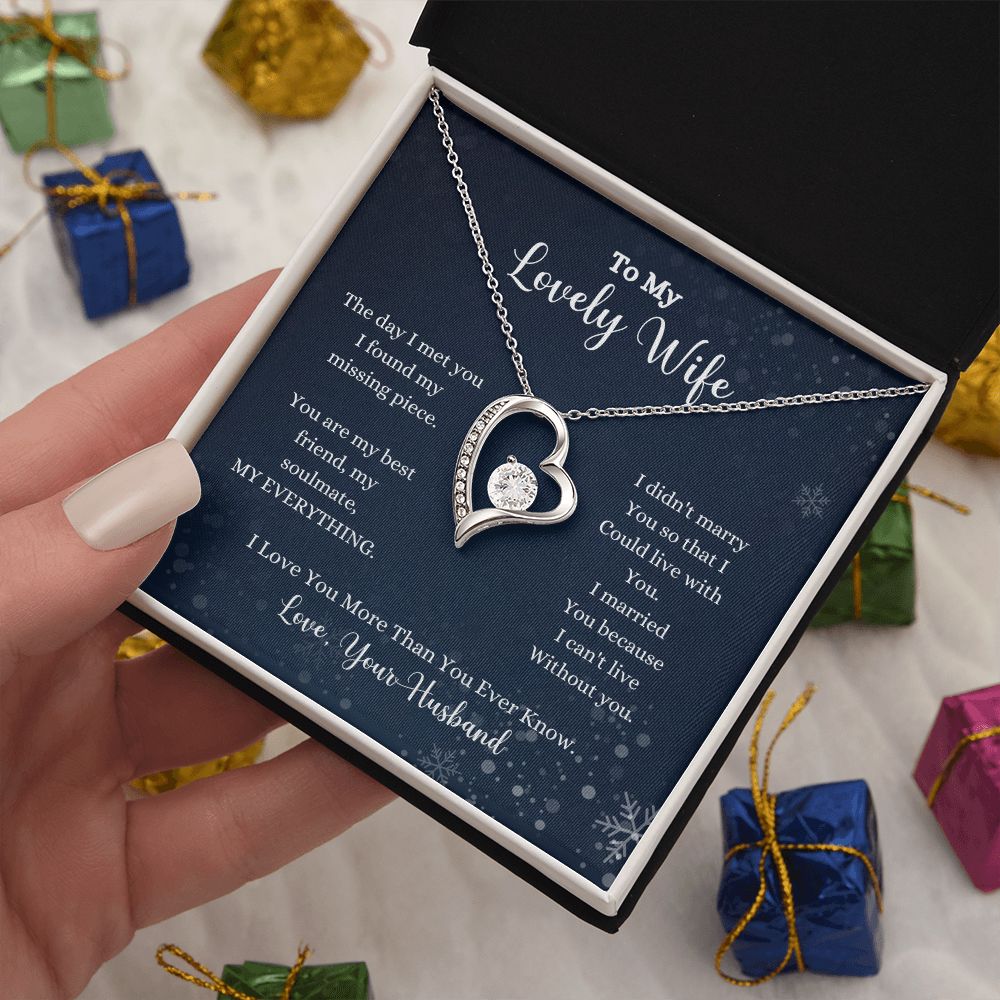 A woman is holding an I Love You More Than You Ever Know Forever Love Necklace - Gift for Wife from Husband by ShineOn Fulfillment, with a poem in it.