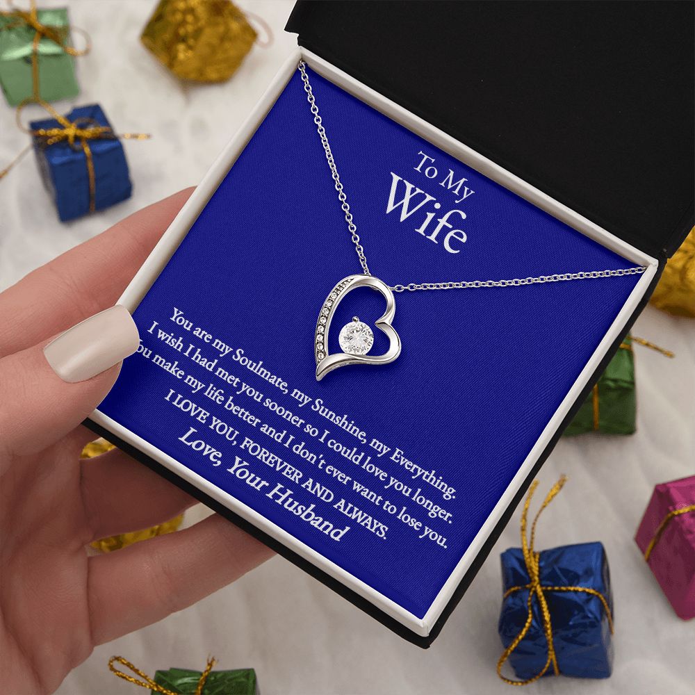 A woman is holding a ShineOn Fulfillment You Are My Soulmate Forever Love Necklace - To Wife from Husband in a gift box.
