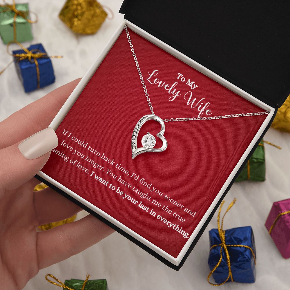 A person holding a gift box with the "I Want To Be Your Last In Everything Forever Love Necklace - To Wife from Husband" by ShineOn Fulfillment.