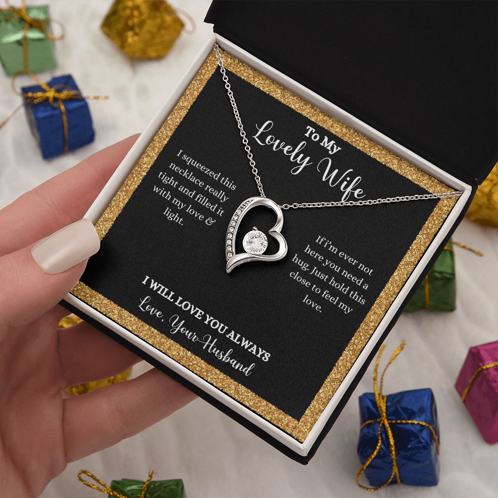 A woman holding a I Love You Forever Love Necklace - Gift for Wife from Husband in a gift box by ShineOn Fulfillment.