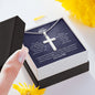 A person holding a You Are Everything To Me Artisan Cross Necklace - For Husband by ShineOn Fulfillment in a gift box.