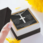 A person holding a ShineOn Fulfillment I Love You For All That That You Are Artisan Cross Necklace – For Husband in a gift box.