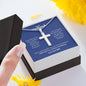 A person holding a Every Day Of My Life Is Perfect Artisan Cross Necklace – For Husband from ShineOn Fulfillment in a gift box.
