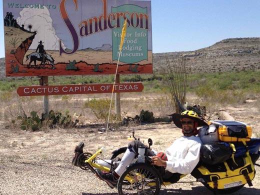 A man cycling a recumbent trike wearing a Da Brim Cycling Classic during his cycling tour.