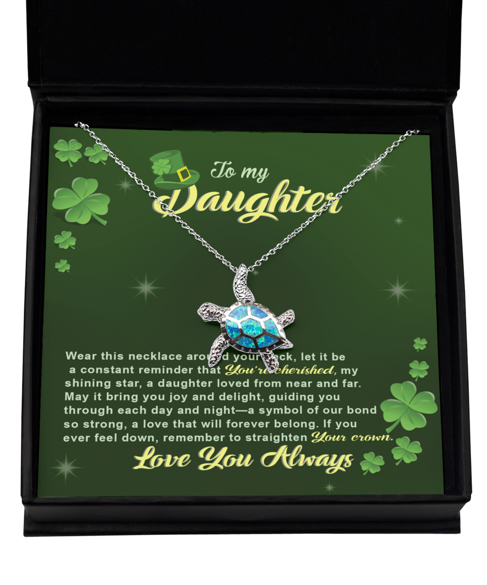 A gift box with a genuine Gearbubble .925 Sterling Silver To My Daughter, Near And Far - Opal Turtle Necklace and shamrocks.
