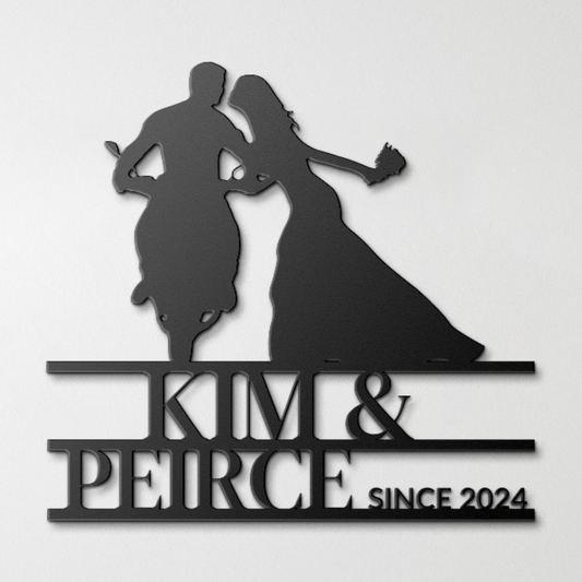 A silhouette of a couple dancing above text reading "kim & peirce since 2024" on a neutral background, crafted from powder coated steel. - Custom Motorcycle Couple Metal Wall Art
