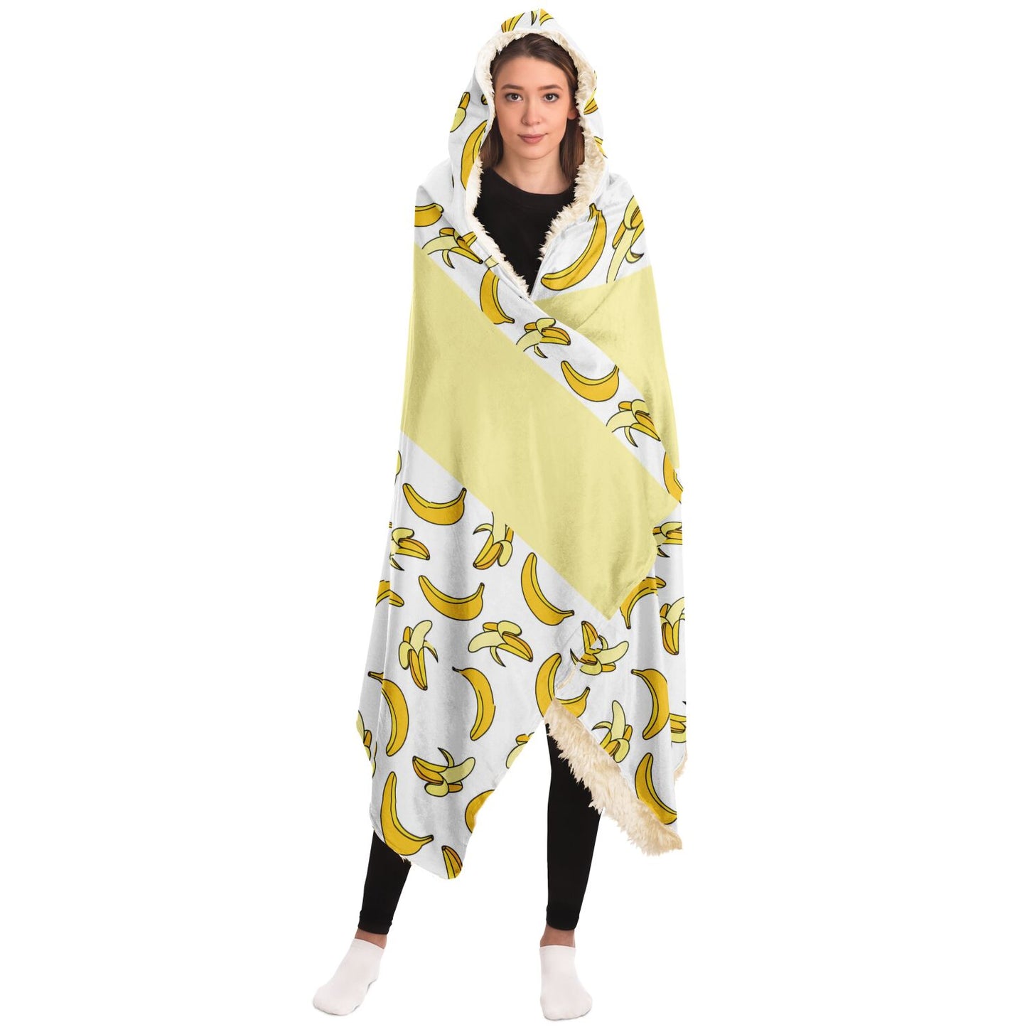 A woman in a Subliminator Nana You're The Best Blanket Hoodie with Banana Pattern adorned with bananas.
