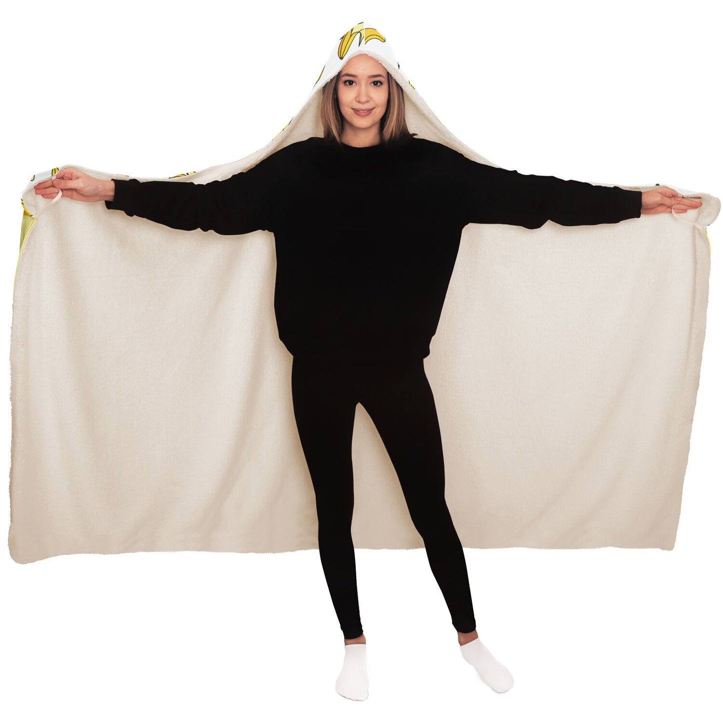 A woman enveloped in a Nana You're The Best Blanket Hoodie with Banana Pattern from Subliminator.