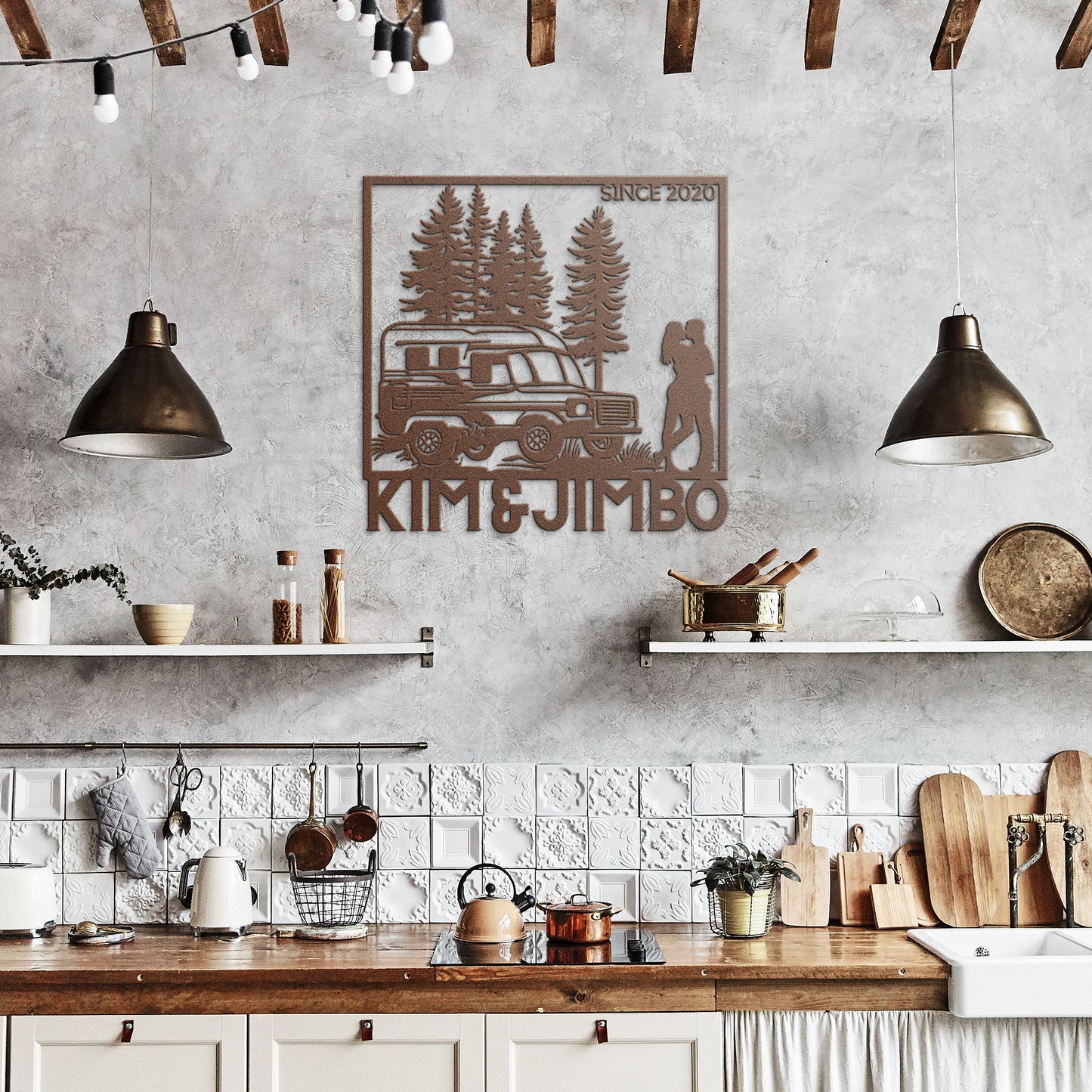 The Camping Couple Metal Art features a silhouette of a camper van, trees, and a couple embracing, with the text "Kim & Jimbo" below and "Since 2020" in the top right corner. This powder-coated metal sign makes for charming home decor.