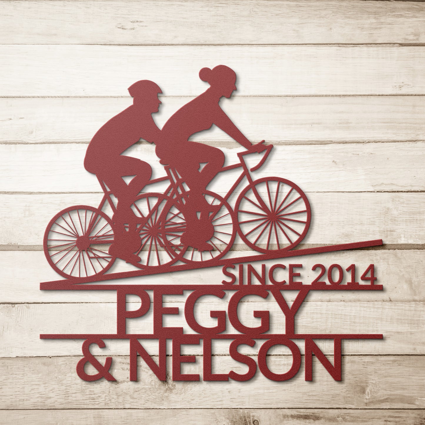 teelaunch's Personalized Couple Cycling Uphill Metal Wall Art Sign is ideal for couples who love to cycle together. This unique sign features the names and year established of Peggy and Nelson.