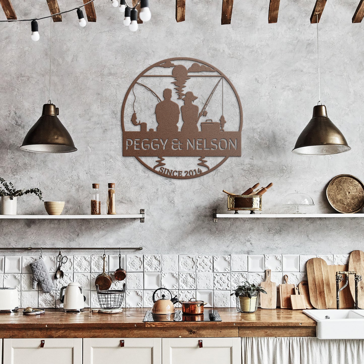 Rustic kitchen with white tiles, wooden shelves, various kitchen utensils, and two pendant lights. A metal sign reading "Couple Fishing Together Metal Wall Art," featuring silhouettes of a couple fishing, adds a charming touch to the home decor.