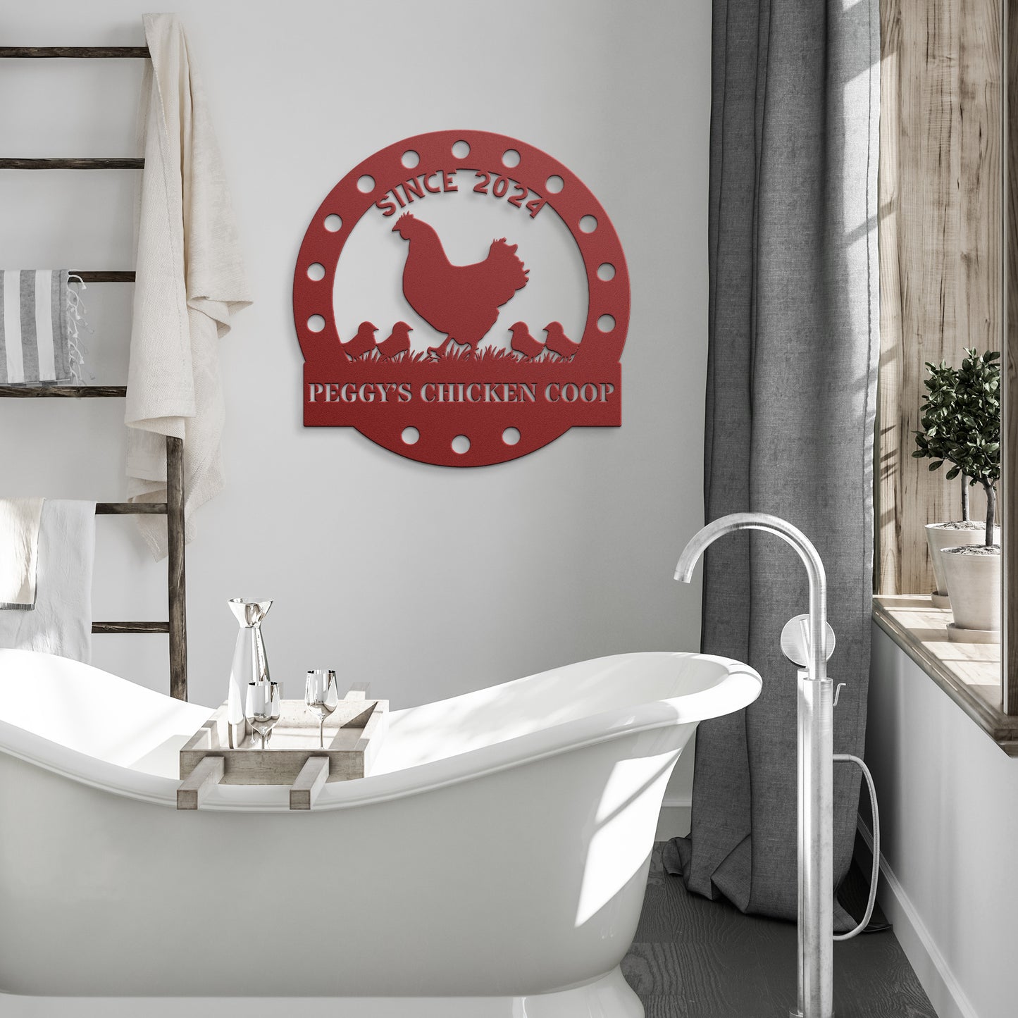 A modern bathroom features a freestanding white bathtub, a wooden ladder towel rack, and a Custom Chicken Coop Metal Sign as tasteful home decor.