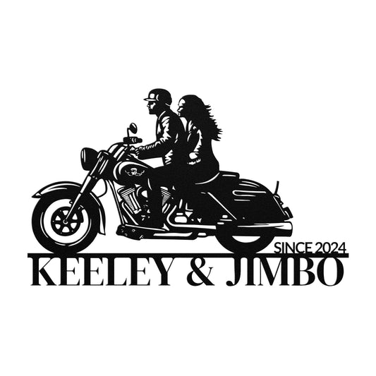 Introducing the Custom Motorcycle Couple Metallic Wall Art, a unique piece featuring the silhouette of two people riding a motorcycle, crafted from 18 gauge steel. It includes the text "Keeley & Jimbo, Since 2024" below. This distinctive metal sign is ideal for home decor enthusiasts seeking to personalize their space.