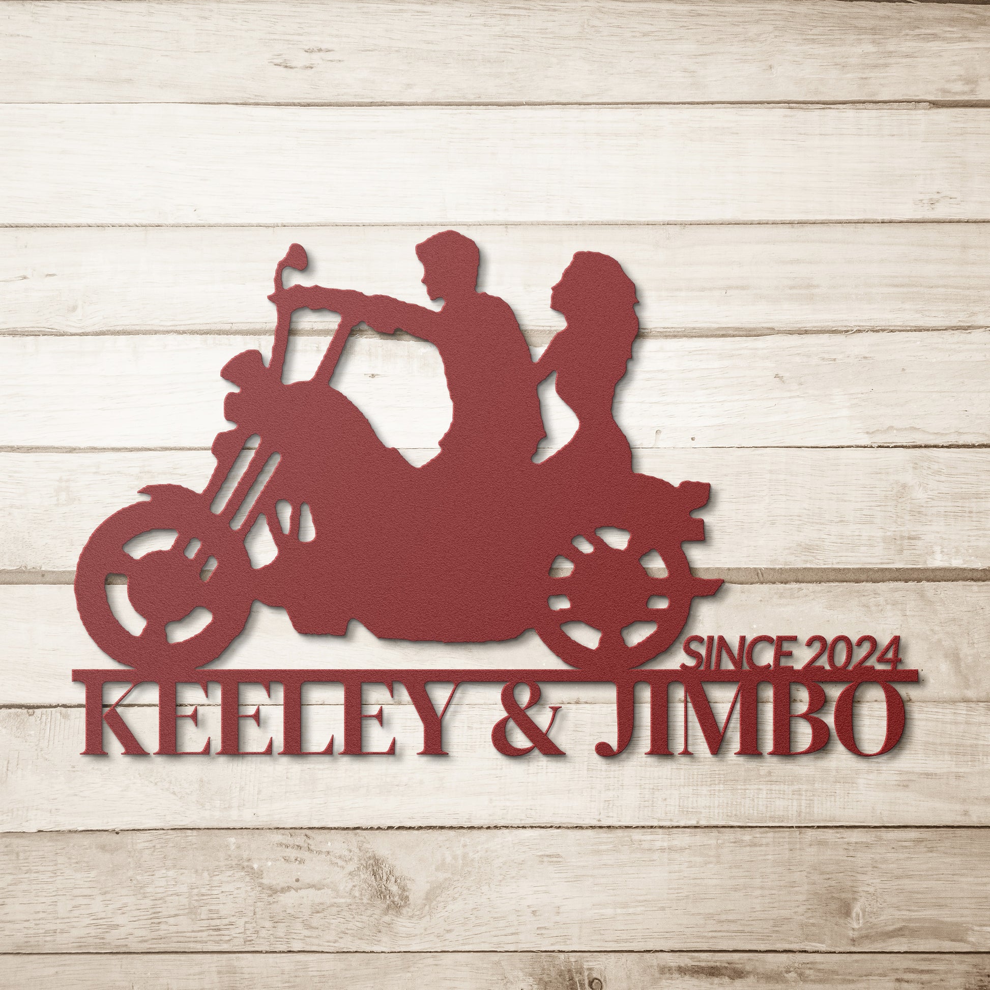 Silhouette of a couple riding a motorcycle with the text "KEELEY & JIMBO" and "SINCE 2024" below them, crafted from premium 18 gauge steel. This striking Custom Motorcycle Couple Metallic Wall Art makes for perfect home decor.

