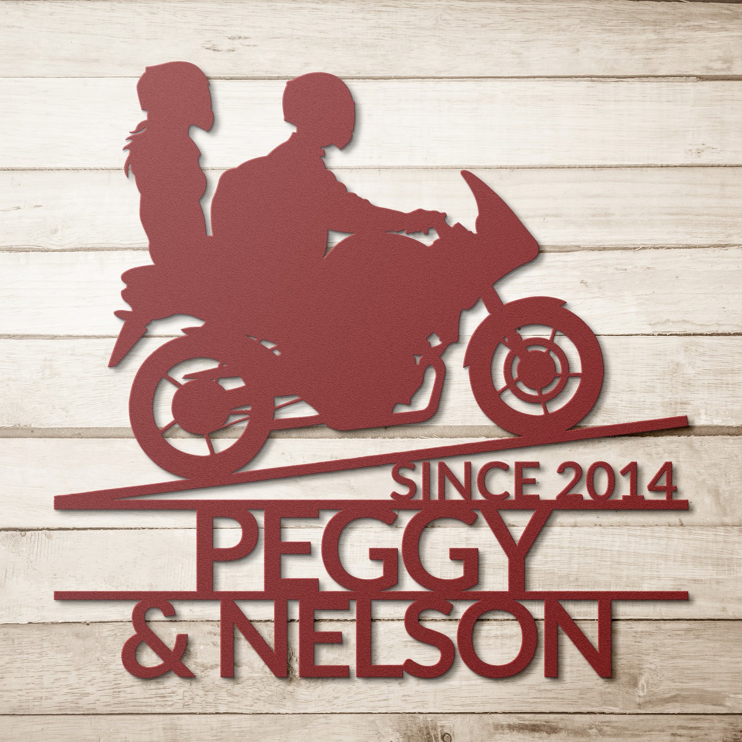 A black Custom Motorcycle Couple Metallic Wall Art featuring a couple riding on a racer bike, personalized with the names Peggy and Nelson and established year since 2014.