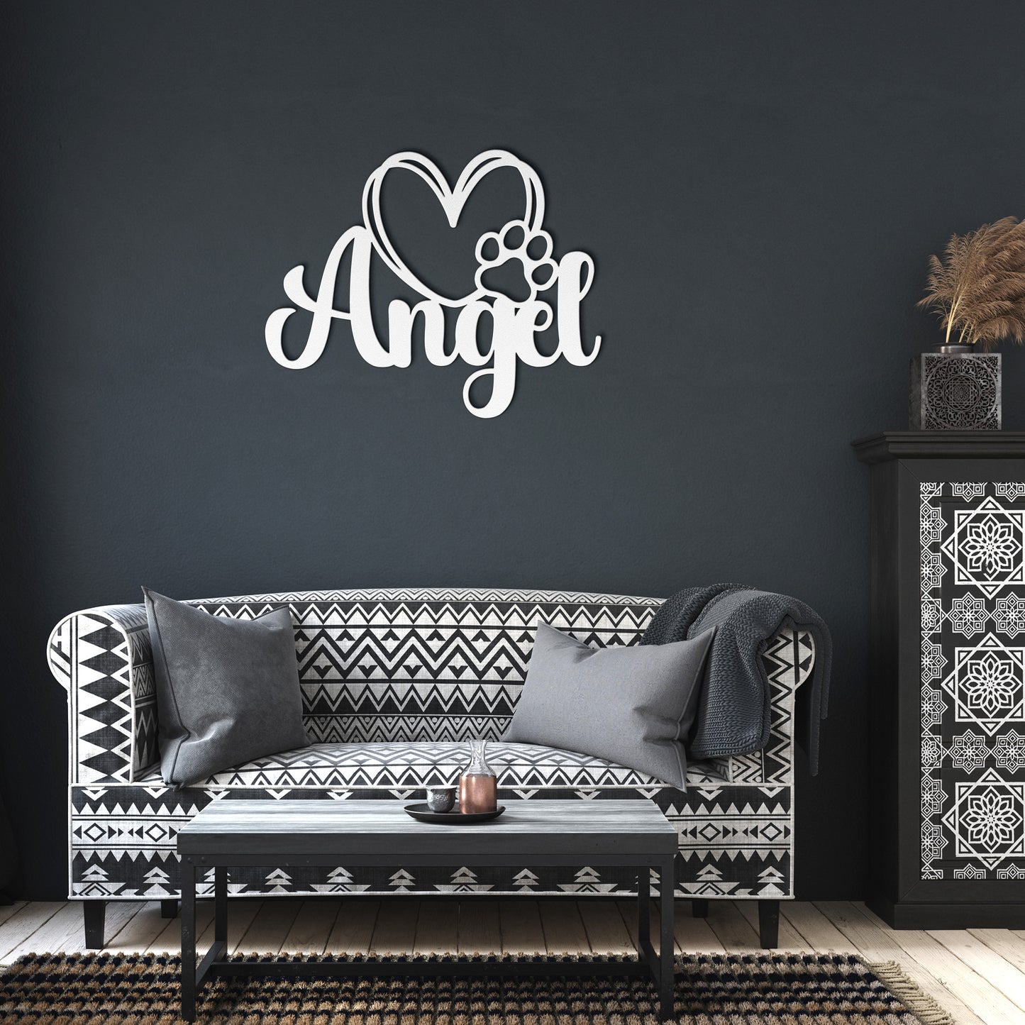 A wooden door with a glass panel in the center is set in a brick wall. To the left of the door is a potted plant with white flowers, and an 18 gauge steel sign that reads "Angel" with a heart and pawprint adds charm to the home decor. This unique touch is provided by the Custom Pet Name Metal Sign with Heart and Paw.