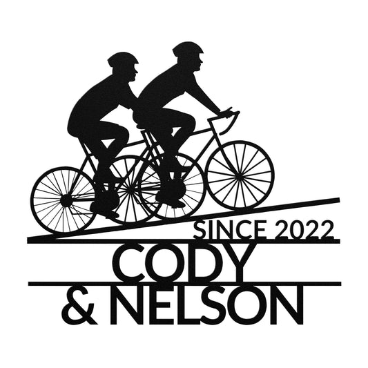 Featuring a silhouette of two cyclists on a tandem bike, the Custom Riding Buddies Metal Sign is powder coated into a sleek metal finish and includes the personalized text "Since 2022 Cody & Nelson" below, making it perfect for modern home decor.