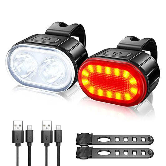 Two Cycling Taillight Headlight Bicycle Lights, one white and one red, displayed with charging cables and mounting straps.