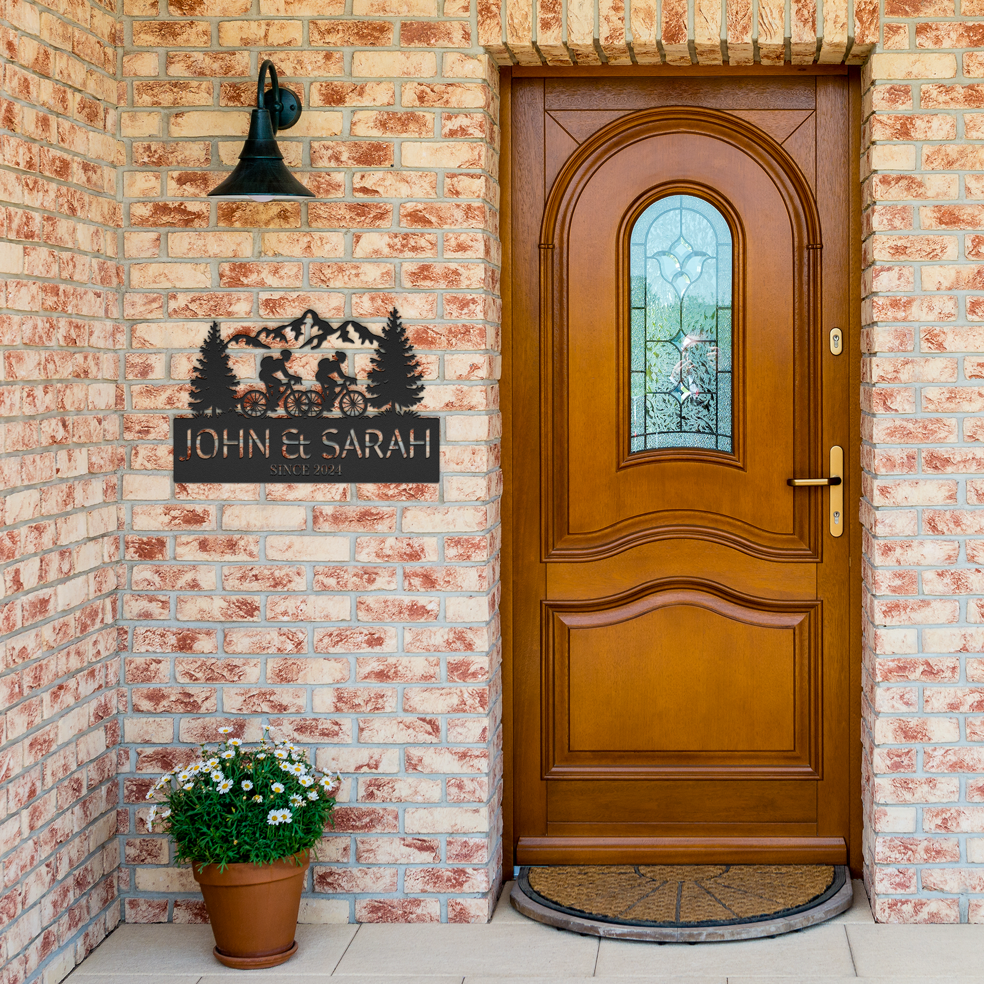 Cycling_Couple_In_the_Mountain_Metal_Art_Black_Brick_Entrance_Mockup.png