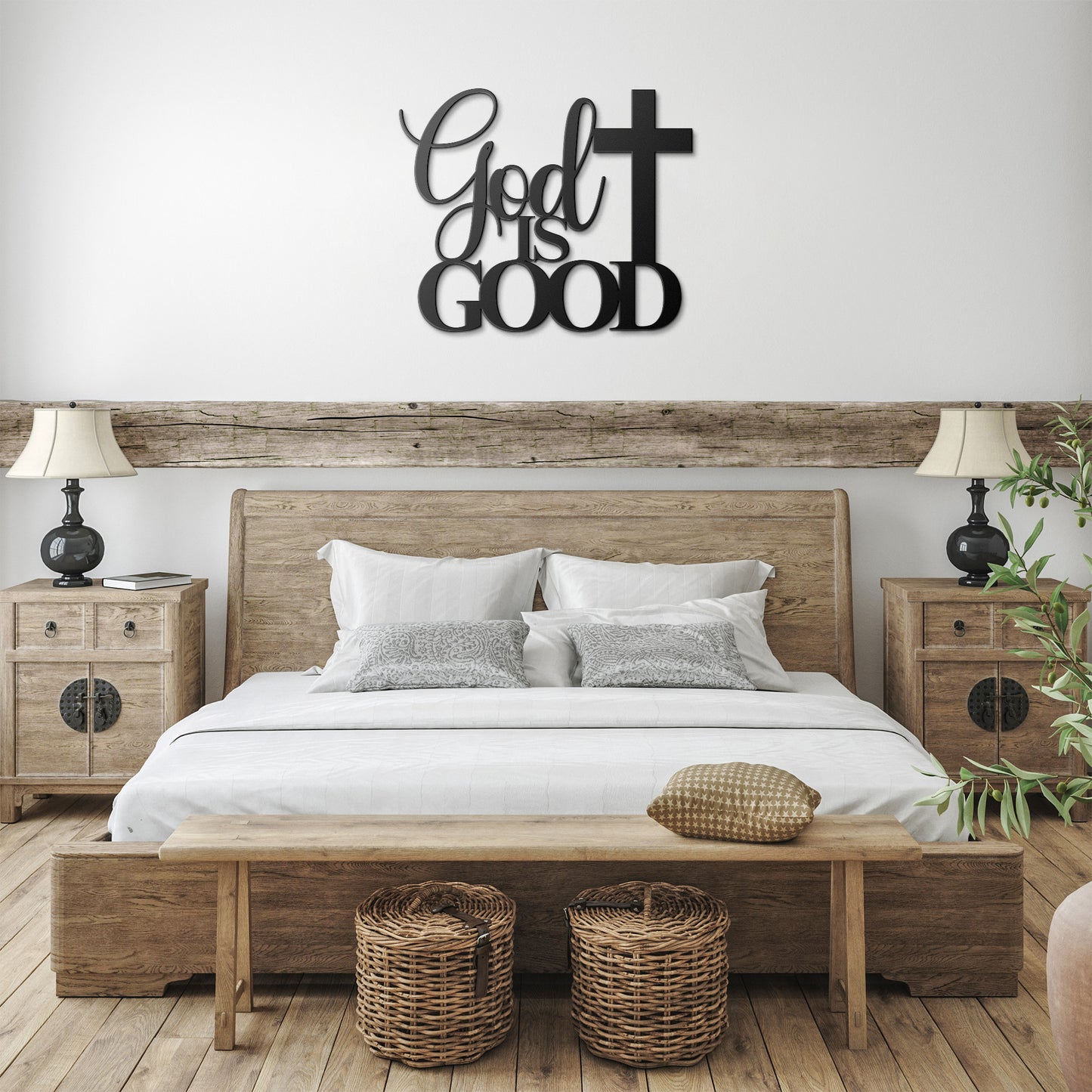 A brown wooden door with decorative glass is set in a brick wall. A potted plant sits beside it, and a stylish powder-coated sign "God Is Good Christian Metal Art" next to a cross enhances the decor. A black outdoor lamp hangs above the sign, completing the charming home decor scene.