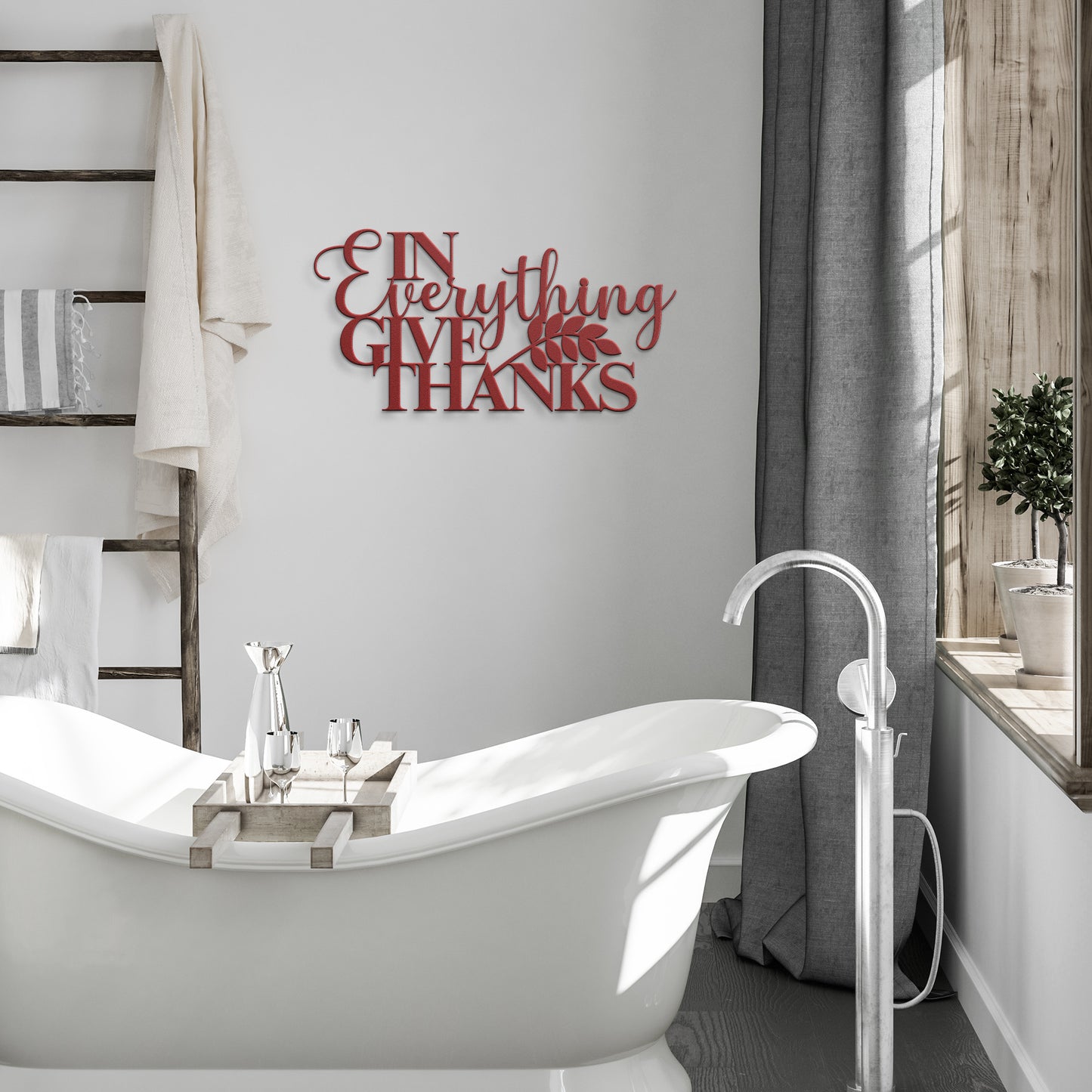 A wooden door with an arched glass panel set in a brick wall features a potted plant sitting next to it. A powder-coated metal sign displaying the message "In Everything Give Thanks Christian Metal Art" hangs beside the door.