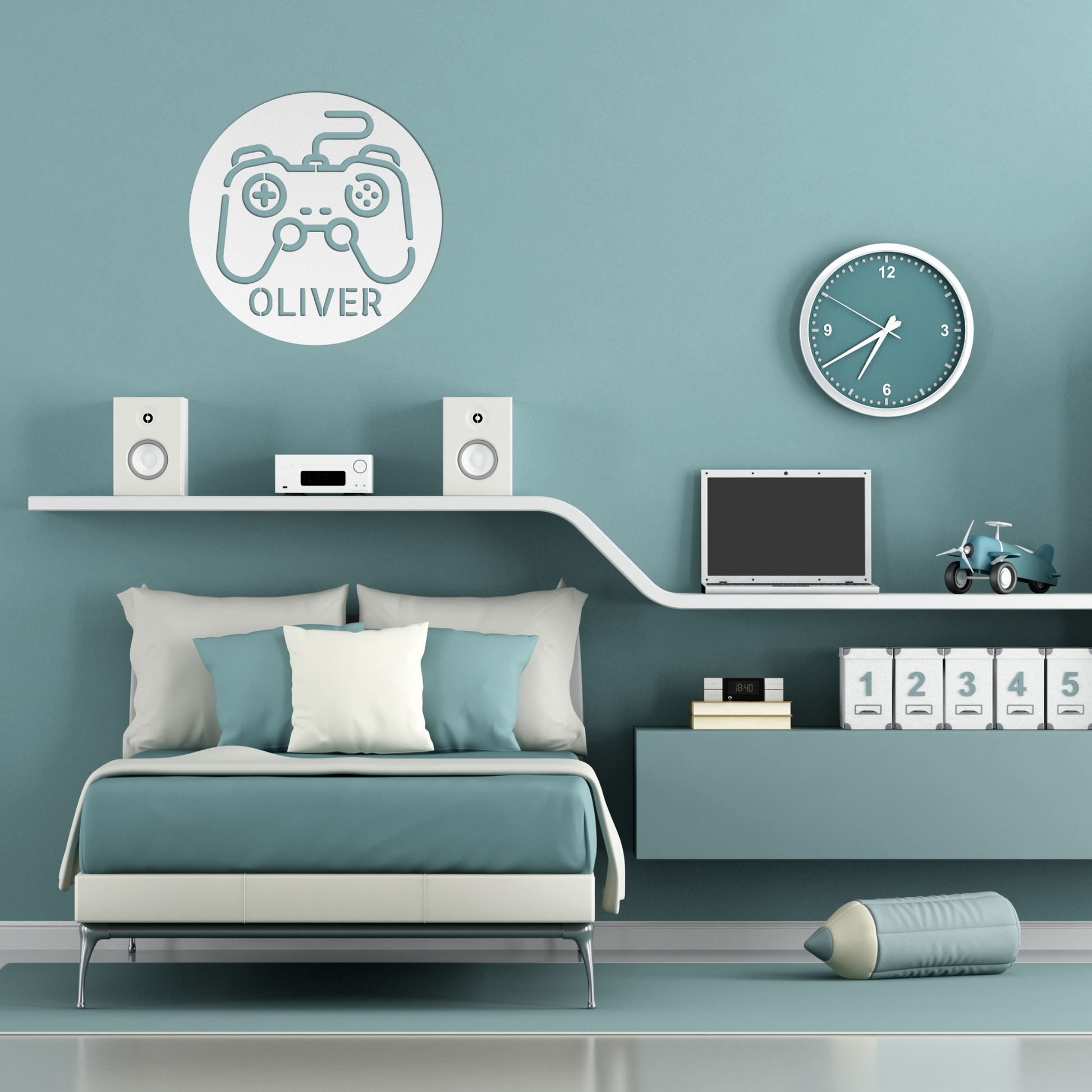 A modern bedroom with teal and white decor, a bed with pillows, a shelf holding speakers, a clock, a laptop, storage boxes, a toy motorbike, and the Personalized Gamer Controller Metal Sign featuring the name "Oliver.