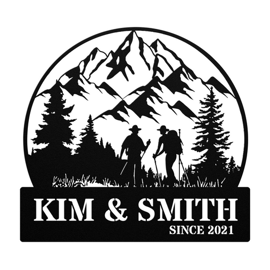 The "Hiking Couple Metal Art" features a beautifully crafted silhouette of two hikers and trees with mountains in the background. Made from 18 gauge steel, it includes the text "Kim & Smith Since 2021" at the bottom. This piece is perfect as a home decor addition or as a metal sign for any space.