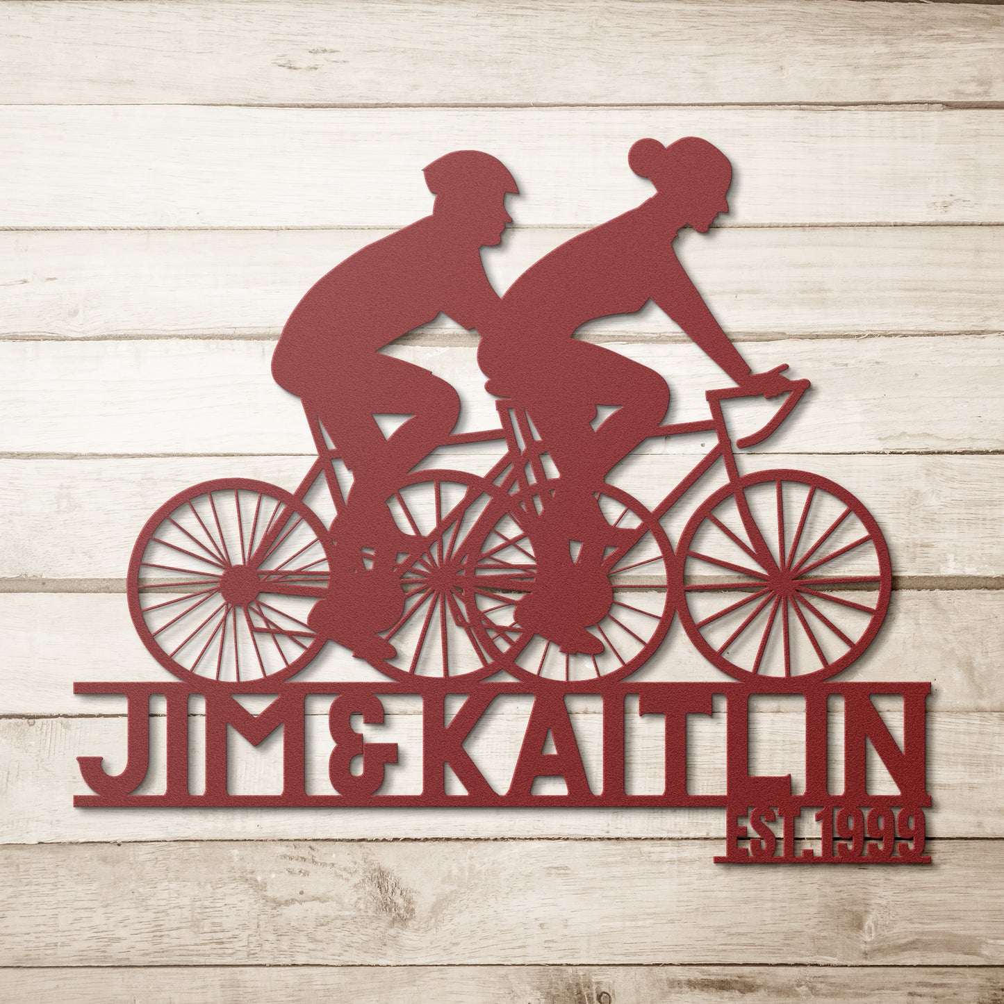 A teelaunch Personalized Couple Cycling Metal Wall Art Sign, featuring a silhouette of a couple riding bikes, perfect for home decor.