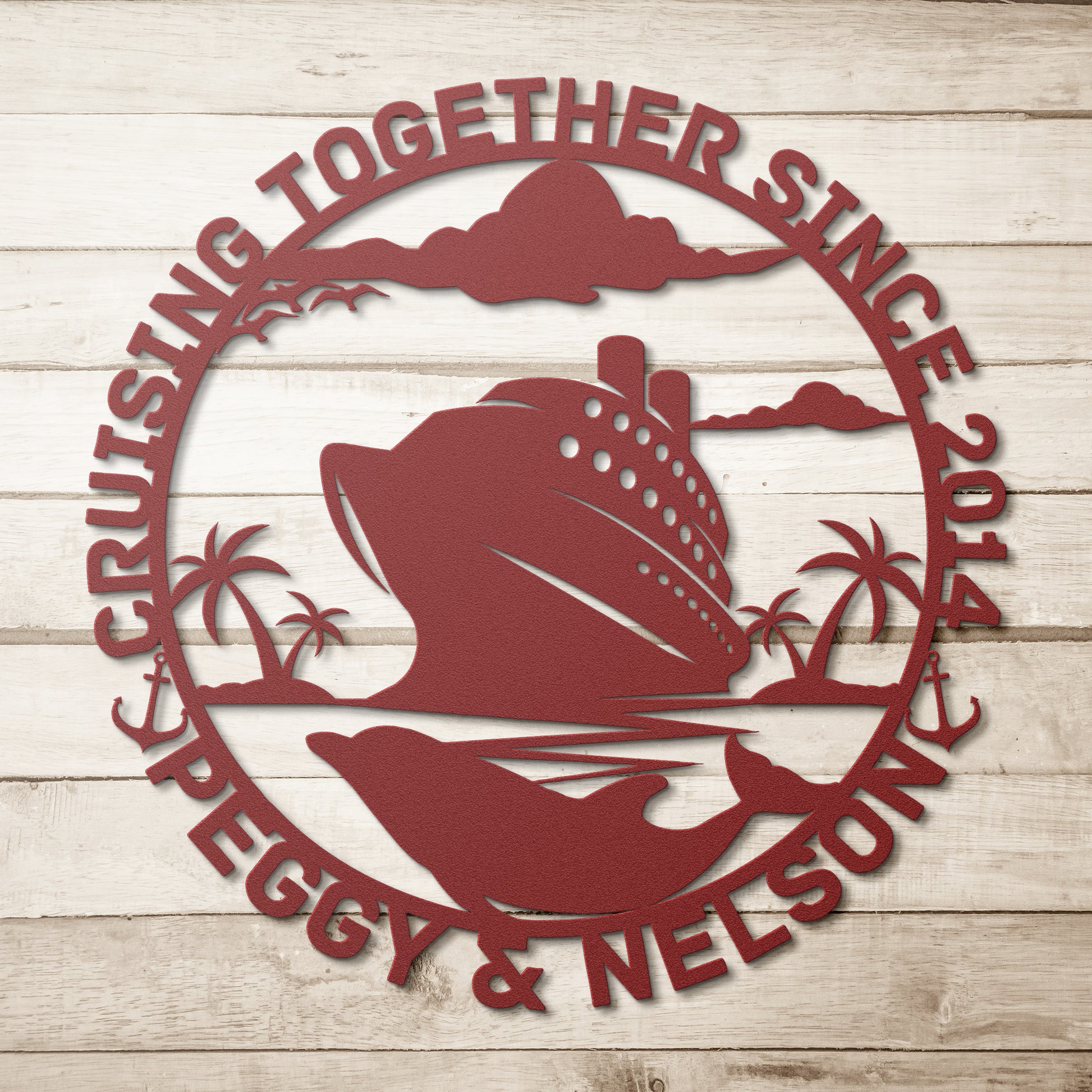 The Personalized Cruise Couples Metal Wall Art is expertly crafted from 18 gauge steel, showcasing a cruise ship and dolphin surrounded by palm trees and clouds, with the text "Cruising Together Since 2014 Peggy & Nelson" elegantly displayed on its wooden background, making it an ideal home decor piece.