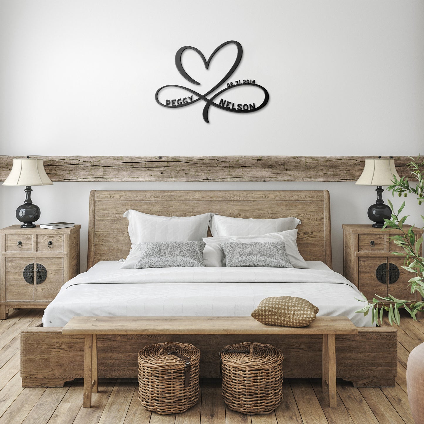 A bedroom with a bed, a bedside table, and a teelaunch Personalized Infinity Love Heart Metal Art Sign.