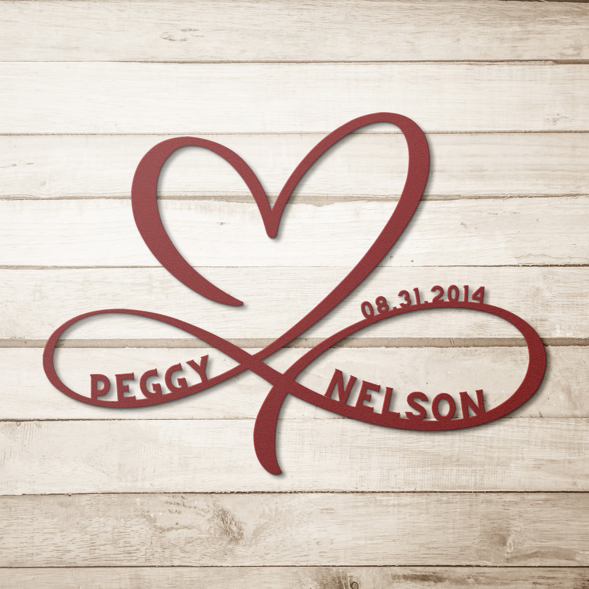 A Personalized Infinity Love Heart Metal Art Sign made by teelaunch, made of 18 gauge steel, powder coated, engraved with the names of the bride and groom.