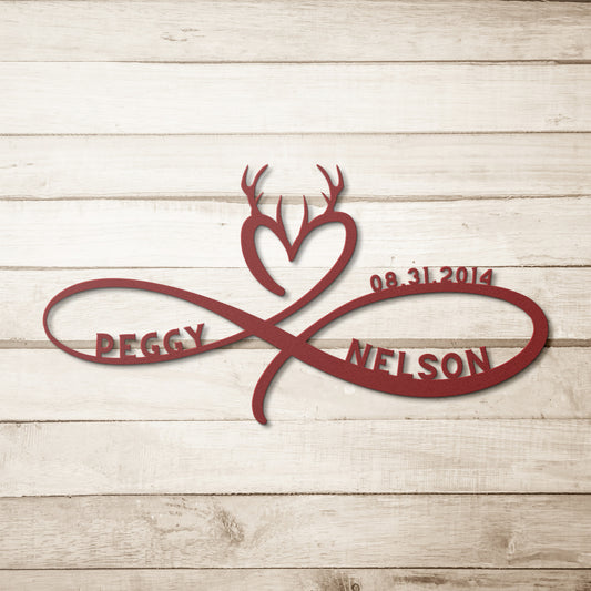 A wooden door with a decorative glass panel is set in a brick wall. A potted plant sits on the doorstep. The names "Peggy" and "Nelson" are elegantly displayed on a Personalized Infinity Love Heart Metal Sign For Hunting Couples, crafted from durable 18 gauge steel.