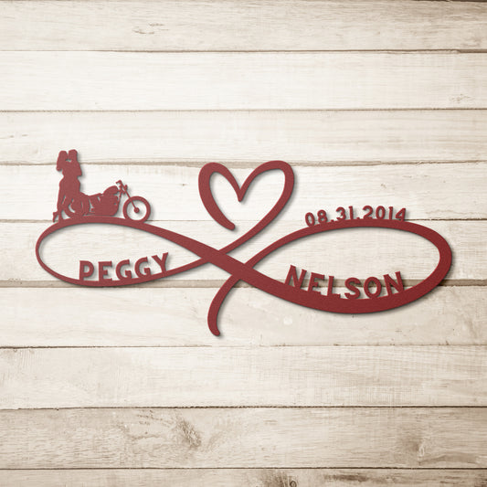A wooden door with an arched, stained-glass window set in a brick wall. A lantern is mounted above the door, and a Personalized Infinity Love Heart Metal Sign For Biking Couples with the names "Peggy" and "Nelson" is attached to the wall next to it.