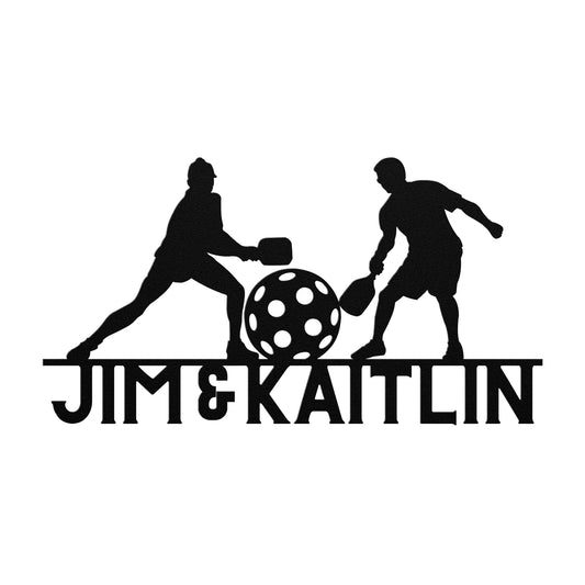 Pickleball Couple Customized Metal Sign: Features a silhouette of two people playing pickleball with paddles and a ball crafted from 18-gauge steel, along with the text "Jim & Kaitlin." This sign is perfect for adding a unique touch to your home decor.
