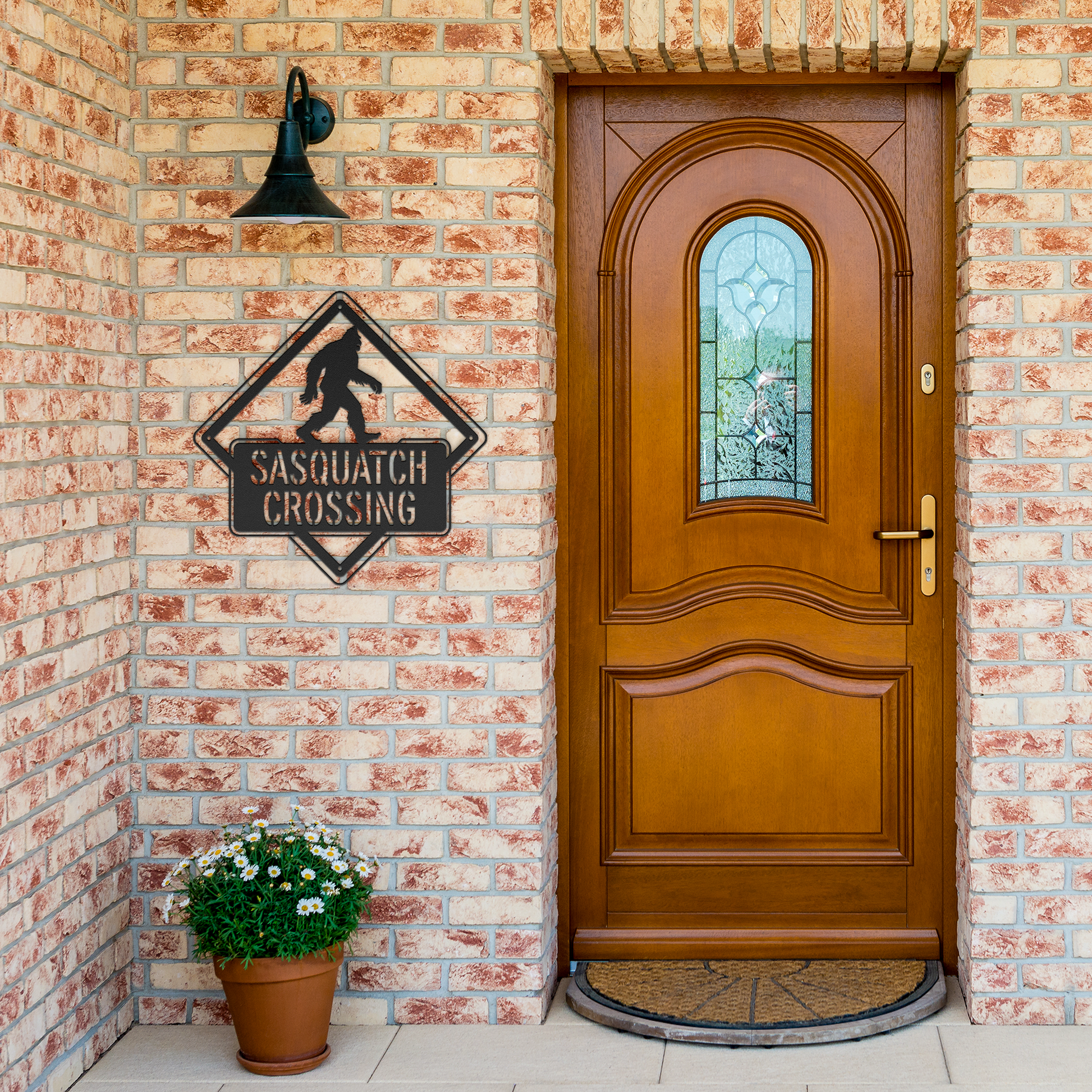 Sasquatch_Crossing_Metal_Sign_Black_Brick_Entrance_Mockup.png