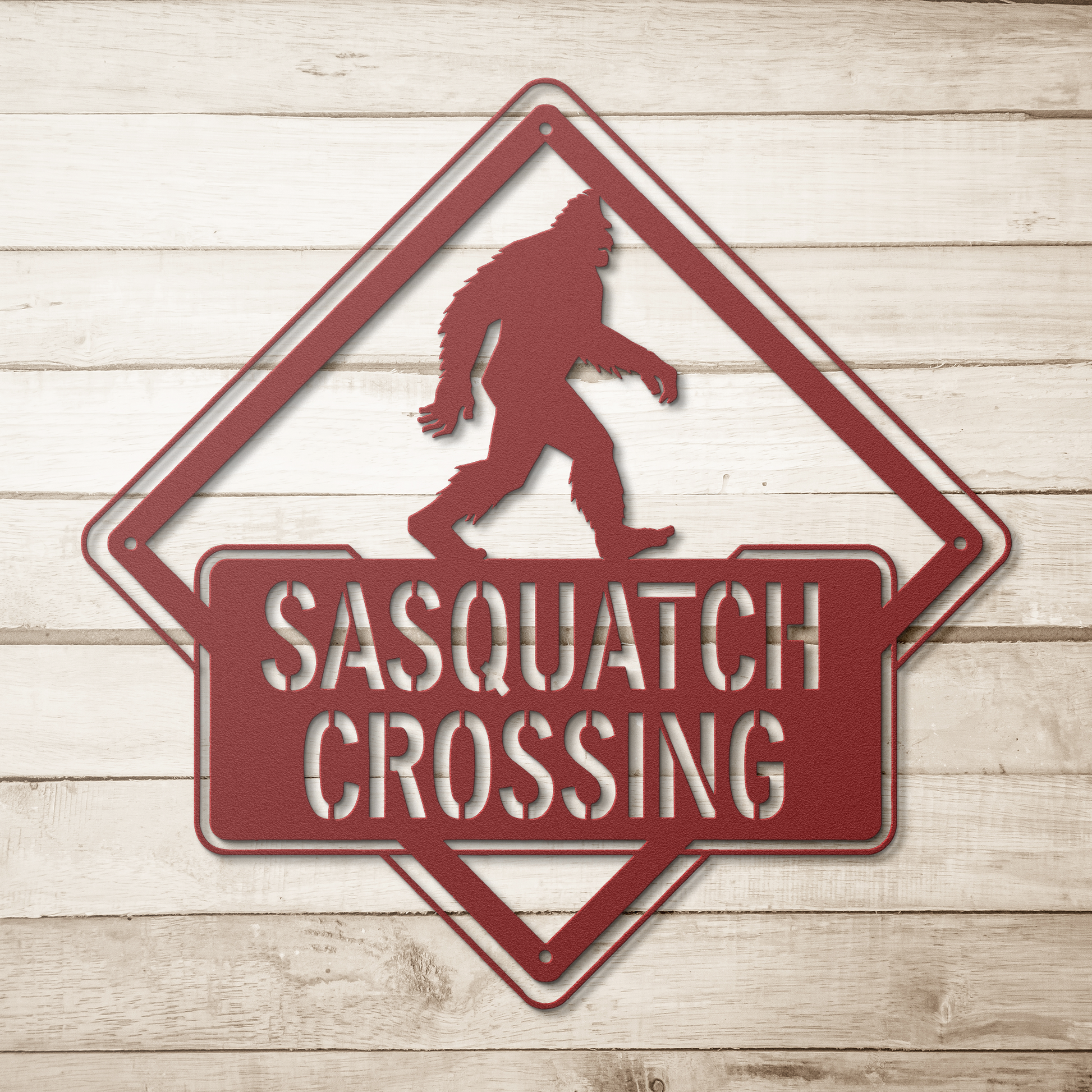 Sasquatch_Crossing_Metal_Sign_Red_Simple_Wood_BKGD_Mockup.png