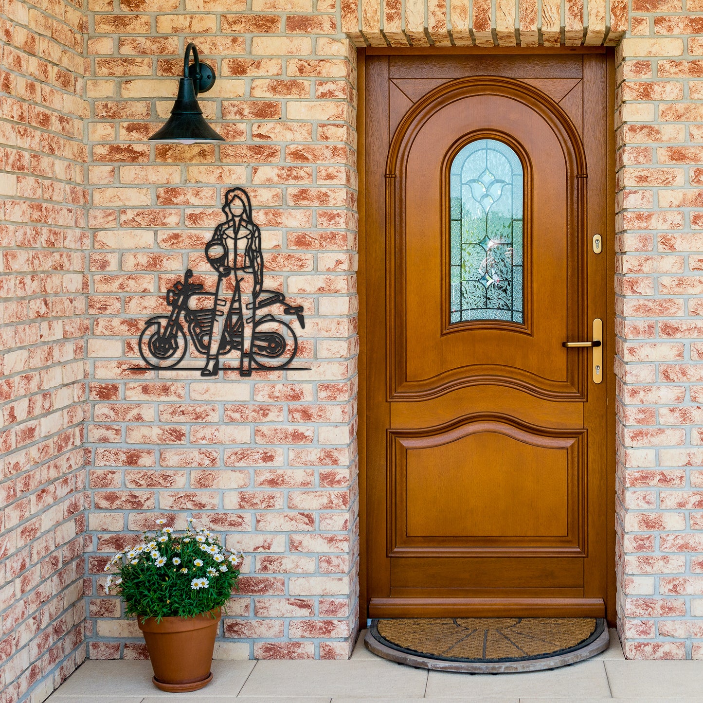 The "Woman Biker" features a faceless illustration of a person in motorcycle gear, standing beside a motorcycle and holding a helmet, crafted on an 18 gauge steel metal sign, making it an edgy piece of home decor.