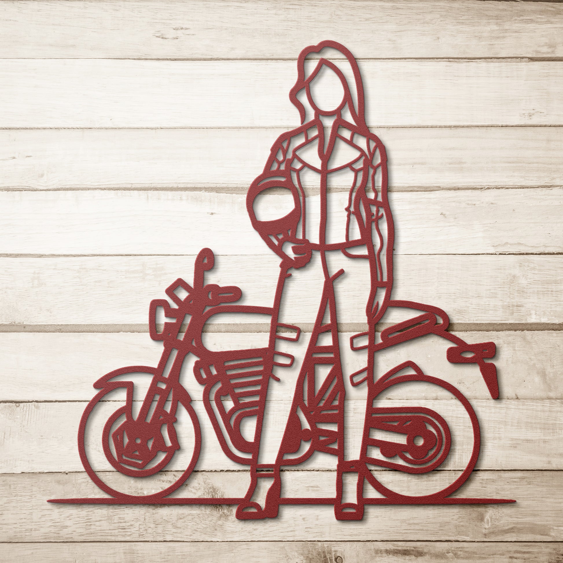A silhouette of a woman in motorcycle gear holding a helmet stands before a bike, with an intricate metal sign backdrop. The 'Woman Biker' scene fuses rugged style and artistic flair, making it unique home decor.