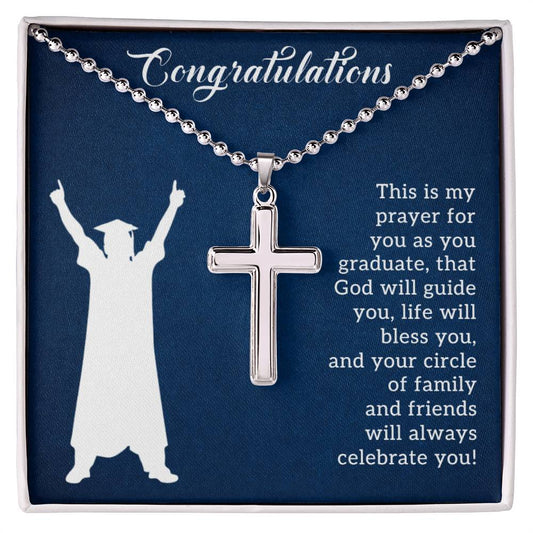 A "Prayer For Graduation" cross necklace from ShineOn Fulfillment displayed on a blue background with a congratulatory message for a graduate and a prayer for guidance and support.